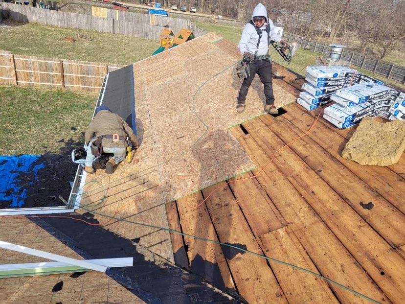 laying down new roof decking