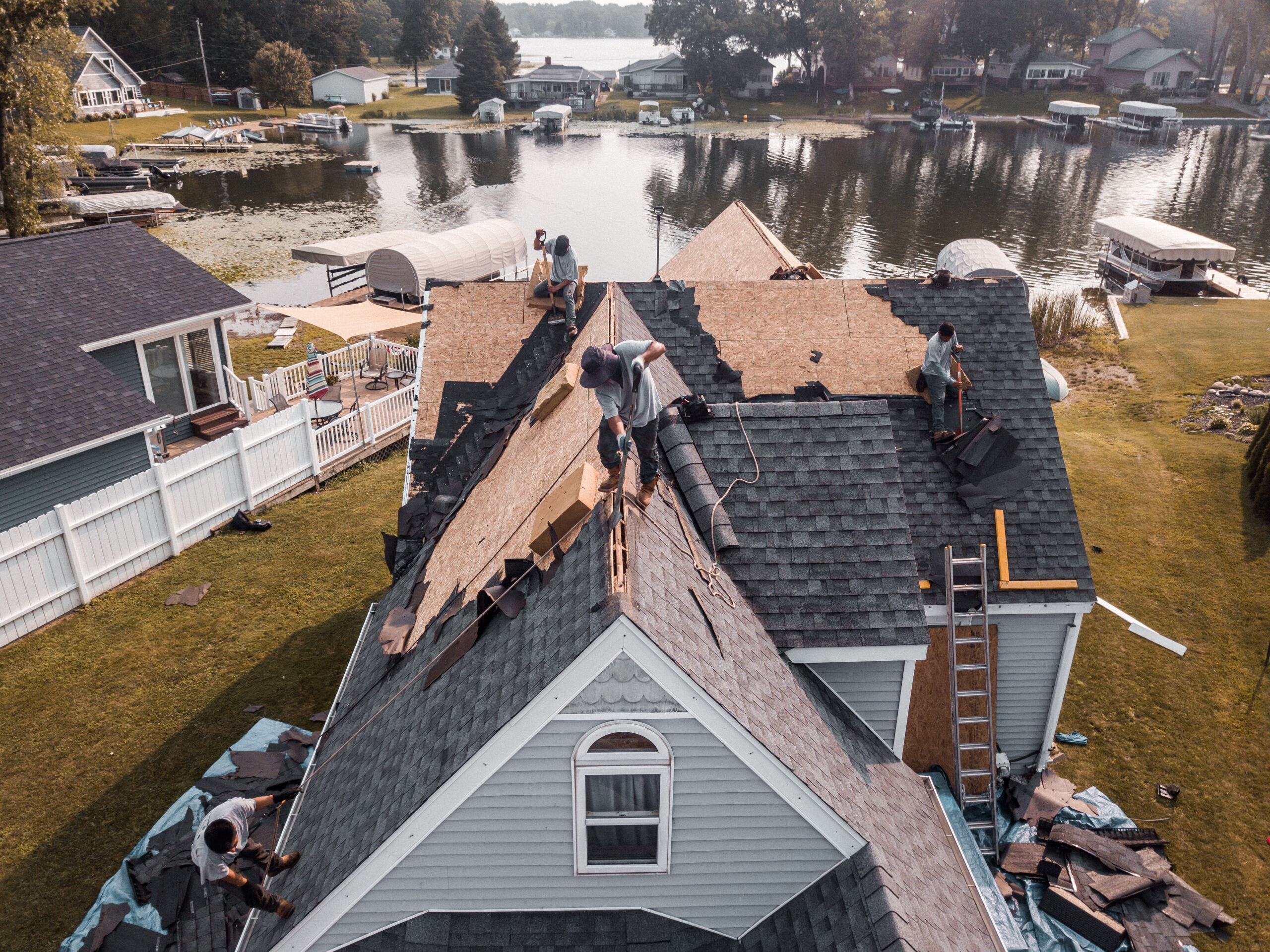 Roof tear off in progress on steep slope