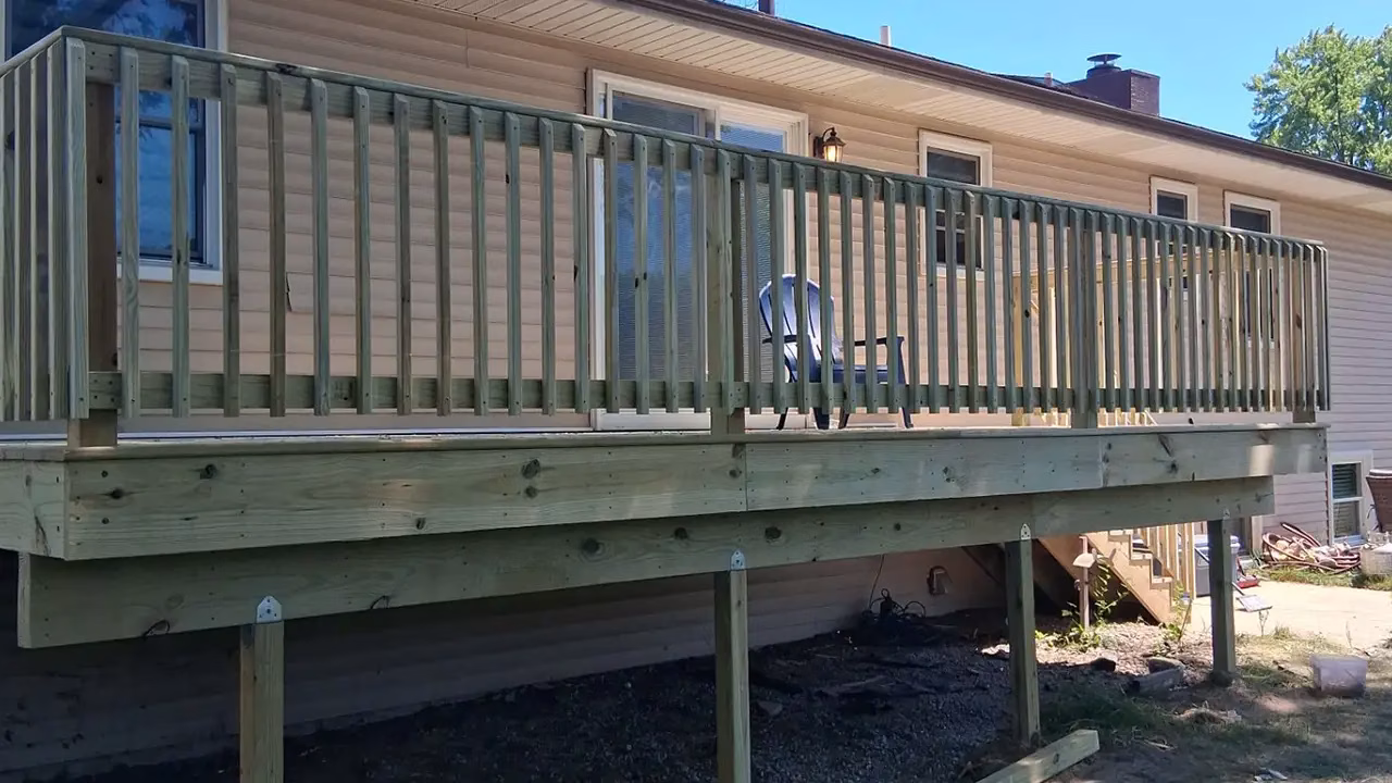 Unsafe, Weather-Damaged Deck Replacement in Kalamazoo, MI 04 New deck ledger board with metal Z-bar flashing installed for moisture protection
