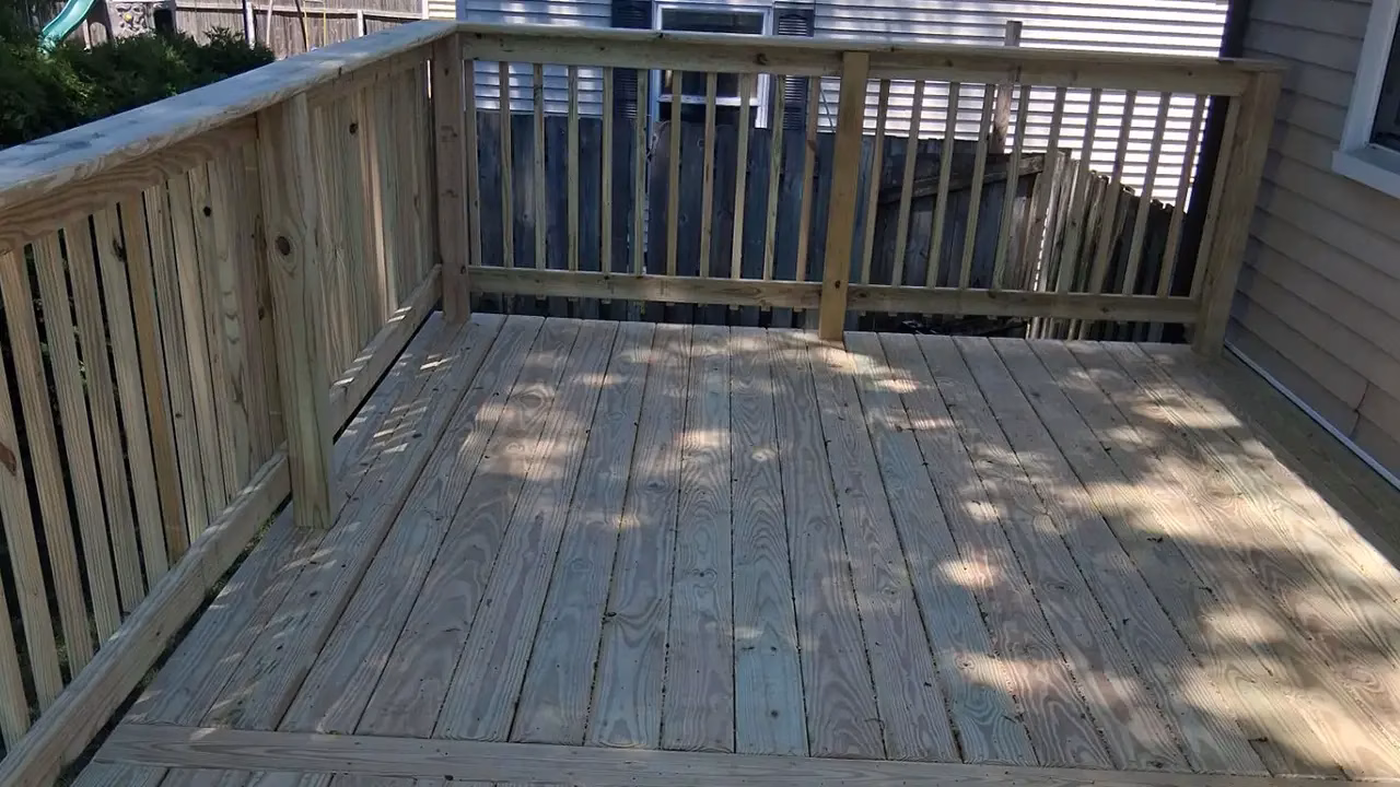 Unsafe, Weather-Damaged Deck Replacement in Kalamazoo, MI 06 Reinforced pressure-treated lumber deck framing with joist hangers and torsion brackets